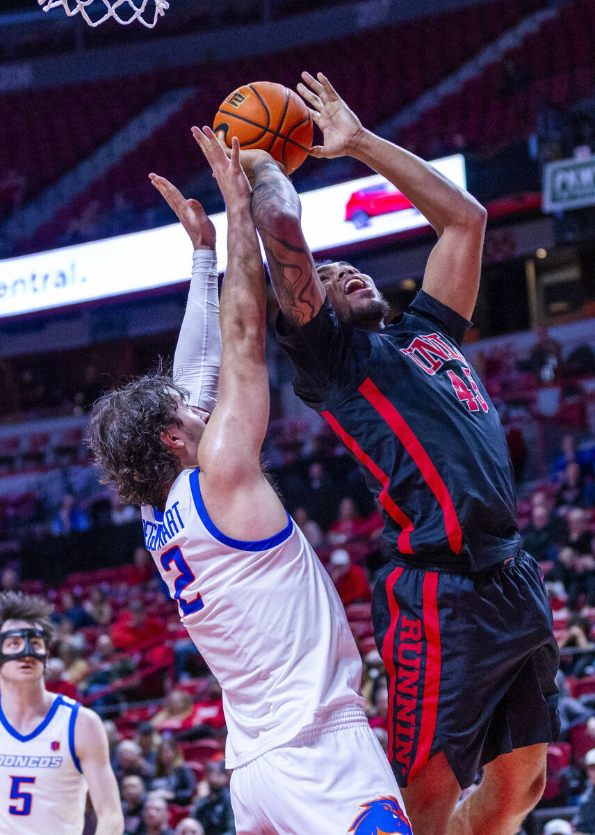 UNLV forward Jeremiah Cherry (45) battles inside for a shot against Boise State Broncos forward ...