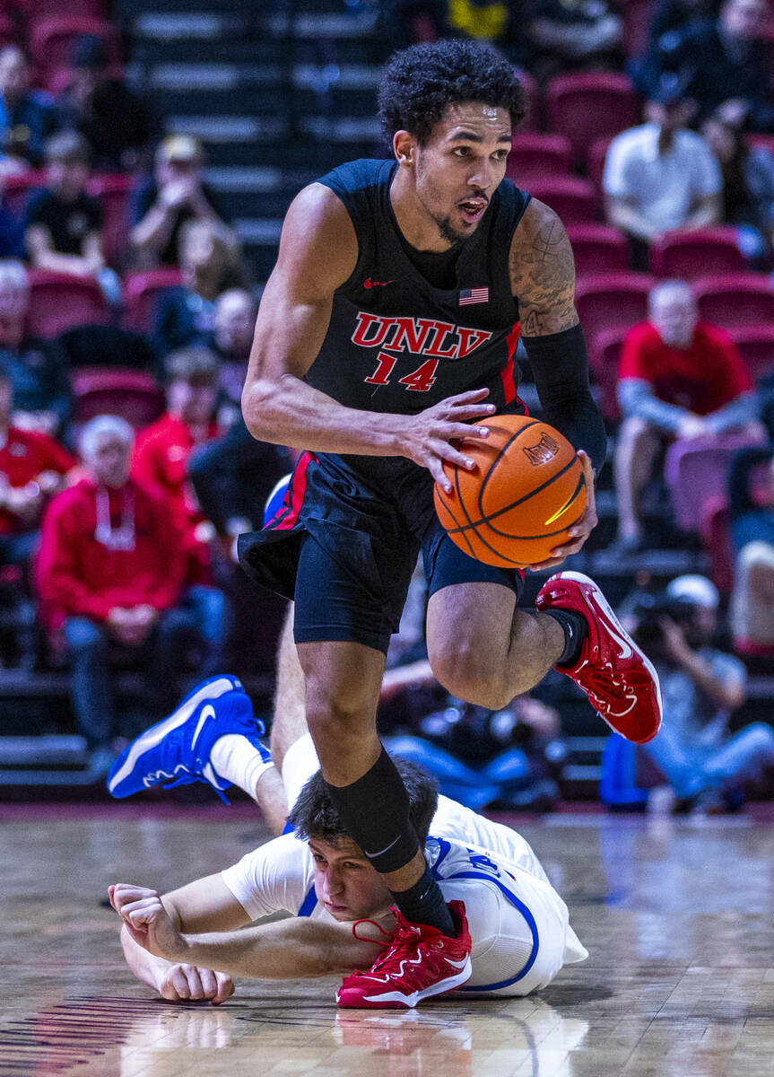 UNLV guard Jailen Bedford (14) looks up the court after stealing the ball from Boise State Bron ...