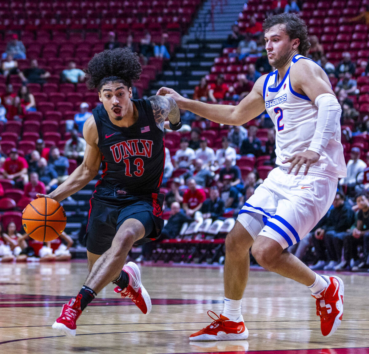 UNLV guard Brooklyn Hicks (13) drives the lane against Boise State Broncos forward Tyson Degenh ...