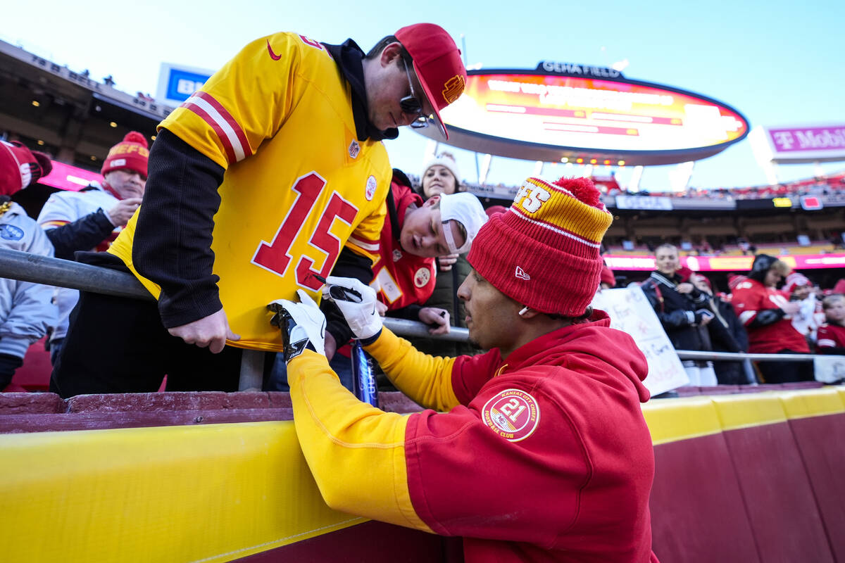 Kansas City Chiefs safety Jaden Hicks signs autographs before the AFC Championship NFL football ...