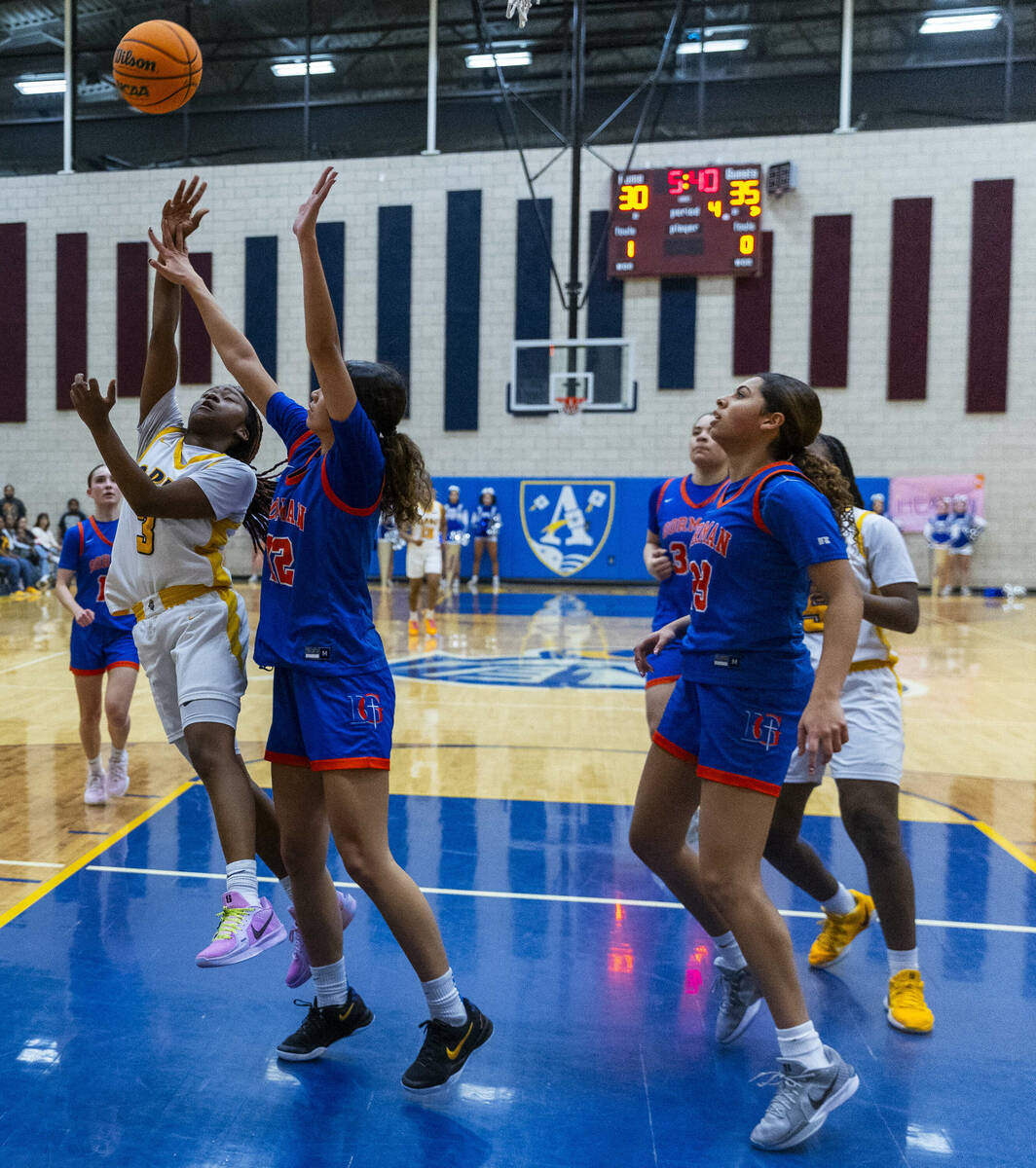 Democracy Prep guard Bray'ana Miles (3) shoots over Bishop Gorman guard Addysen Carr (12) durin ...