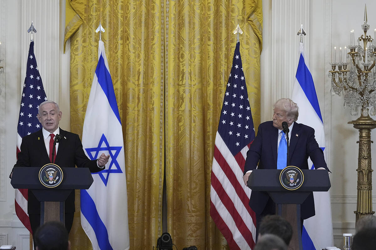 Israeli Prime Minister Benjamin Netanyahu answers questions during a news conference with Presi ...