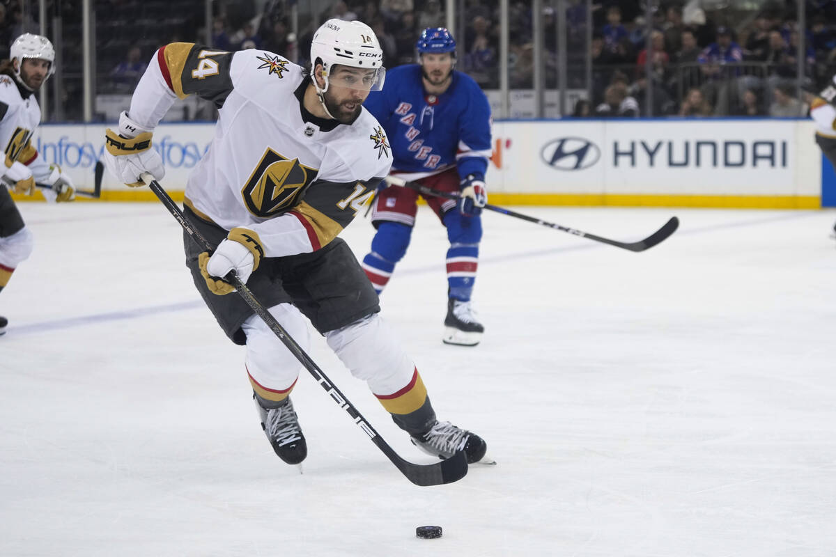 Vegas Golden Knights defenseman Nicolas Hague (14) drives toward the New York Rangers net durin ...