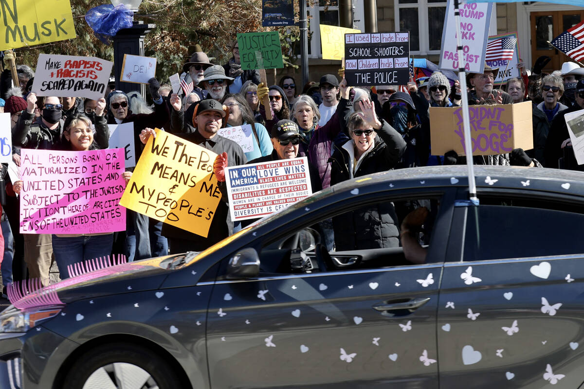 People protest the Trump administration at the Capitol in Carson City Wednesday, Feb. 5, 2025. ...