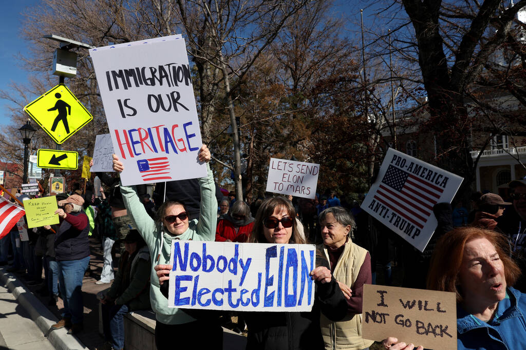 People protest the Trump administration at the Capitol in Carson City Wednesday, Feb. 5, 2025. ...