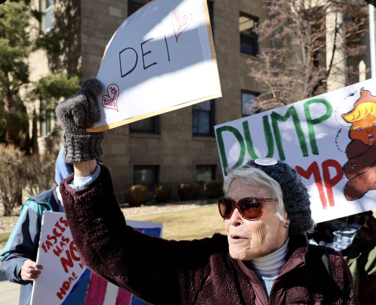People, including Mary Hamilton, 84, of Gardnerville, protest the Trump administration at the C ...