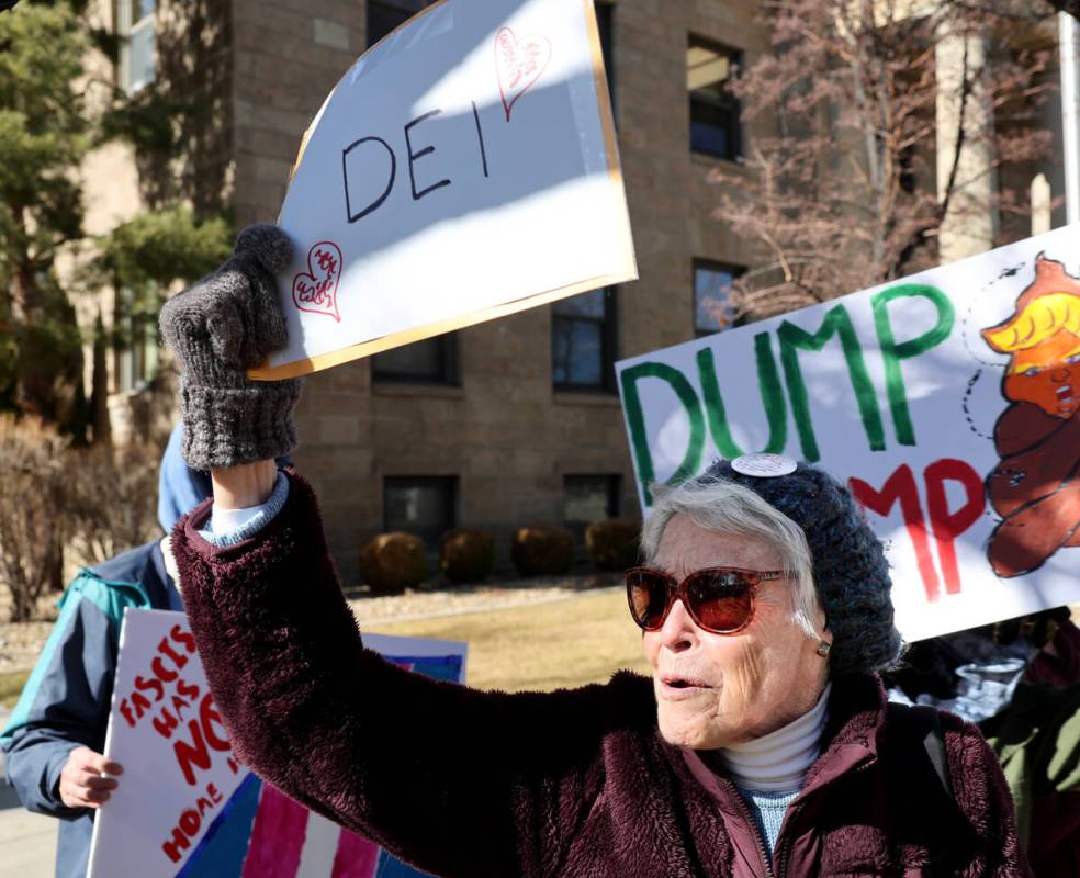 People, including Mary Hamilton, 84, of Gardnerville, protest the Trump administration at the C ...
