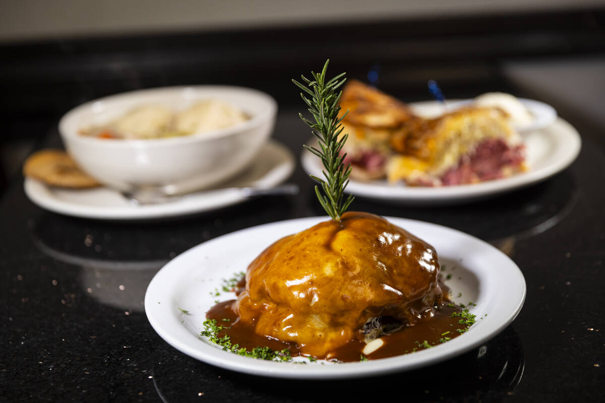 Ceily’s Stack, a sandwich made of two potato latkes stuffed with brisket, topped with cheeses ...