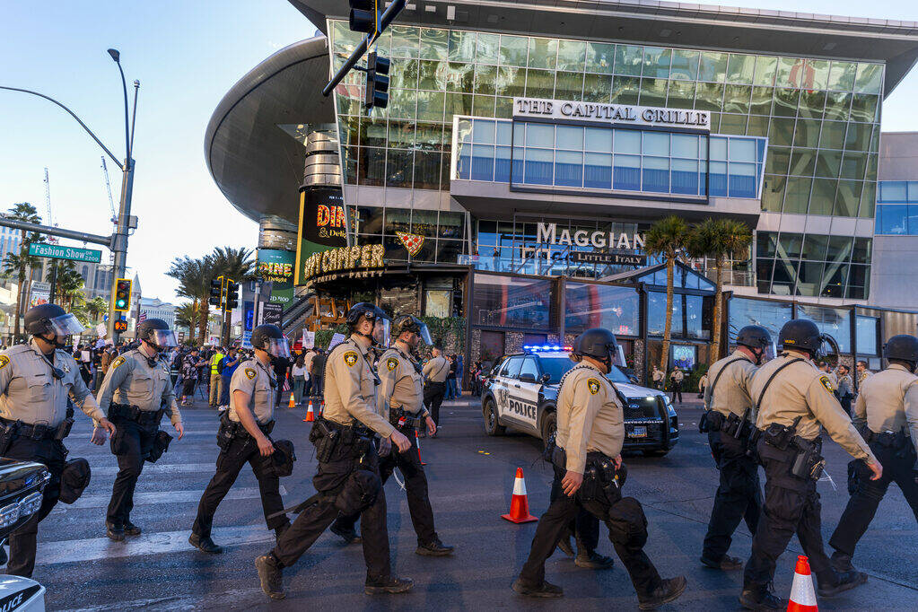 Metro officers work to secure the intersection of Fashion Show Drive and the Strip during a pro ...