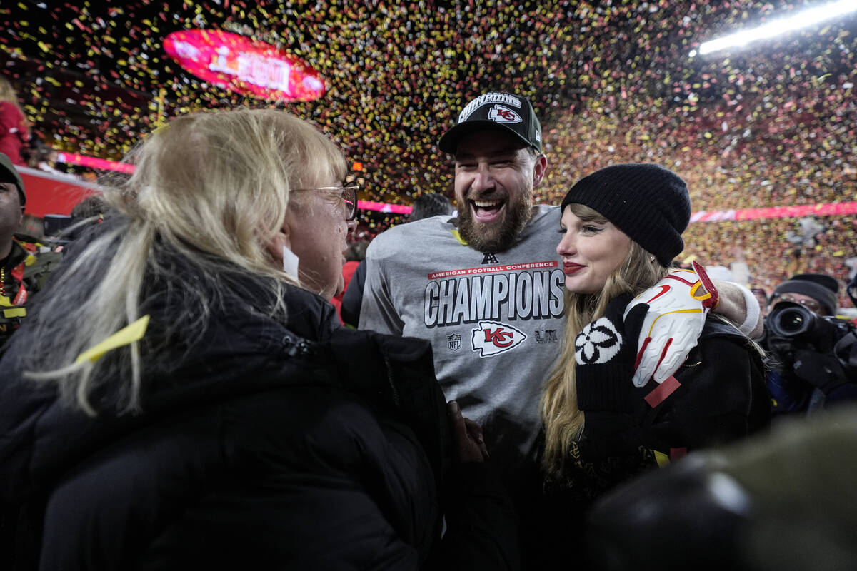 Donna Kelce stands with her son Kansas City Chiefs tight end Travis Kelce and Taylor Swift afte ...