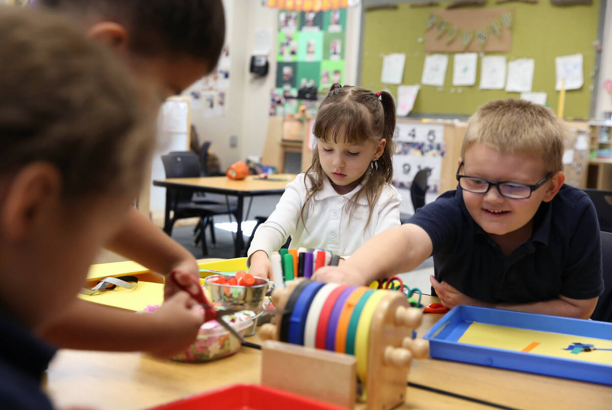 Pre-kindergarten students, including Tricoli Mackenzie, 4, center, and Paxton Wright, 5, right, ...