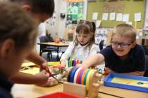 Pre-kindergarten students, including Tricoli Mackenzie, 4, center, and Paxton Wright, 5, right, ...