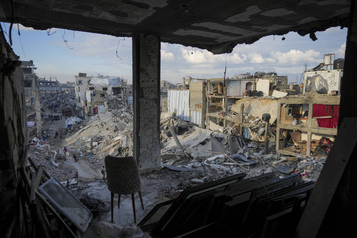 The destruction caused by the Israeli air and ground offensive is seen from a destroyed buildin ...
