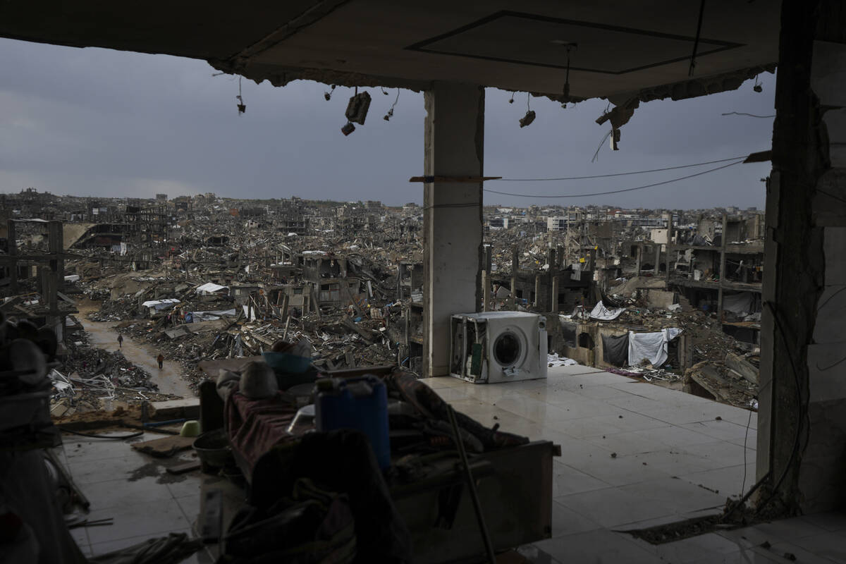 The destruction caused by the Israeli air and ground offensive is seen from a destroyed buildin ...