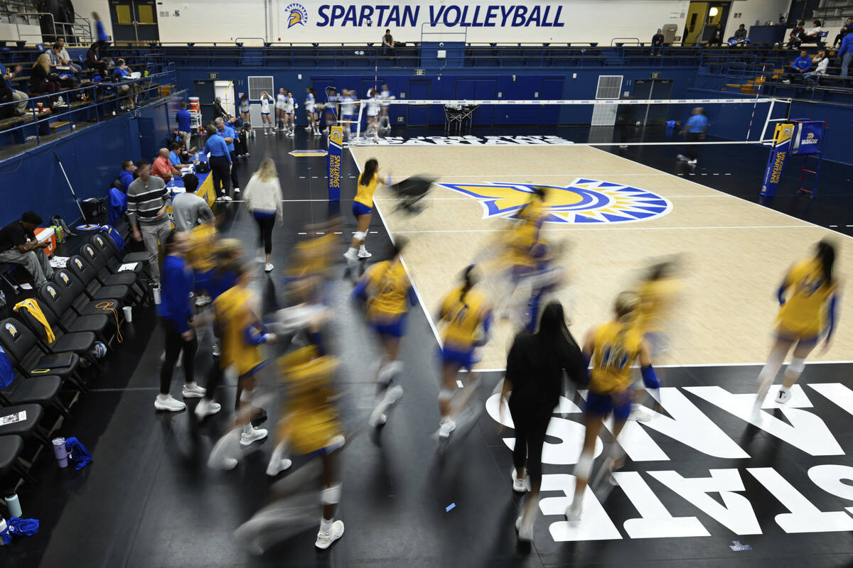 The San Jose State players take the court for warm ups before an NCAA women's college volleybal ...