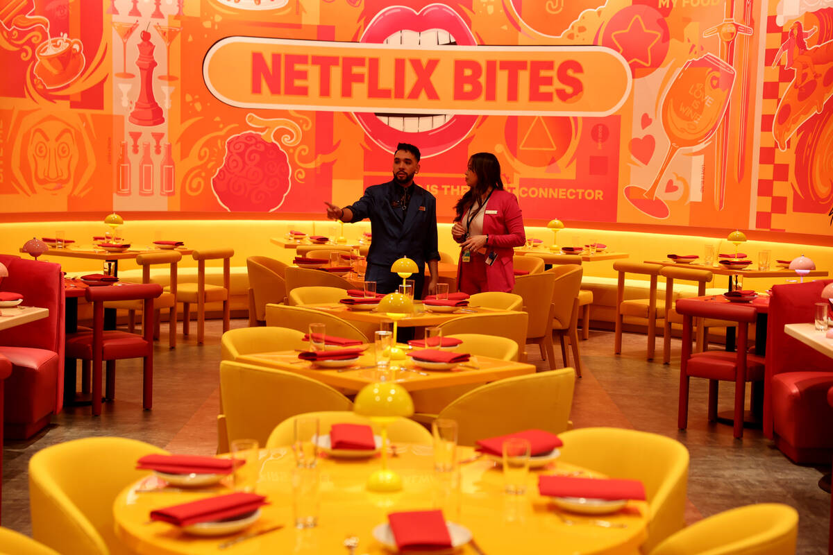 Assistant Manager Stephen Alsvig, left, and General Manager Edith Castro set up Netflix Bites a ...