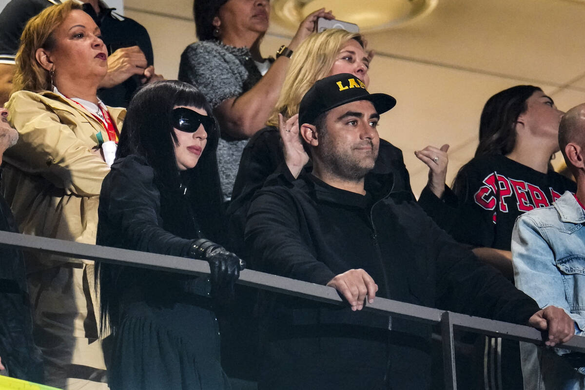 Lady Gaga watches fro the stands during halftime of the NFL Super Bowl 59 football game between ...