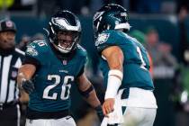 Philadelphia Eagles running back Saquon Barkley (26) reacts to the touchdown with quarterback J ...