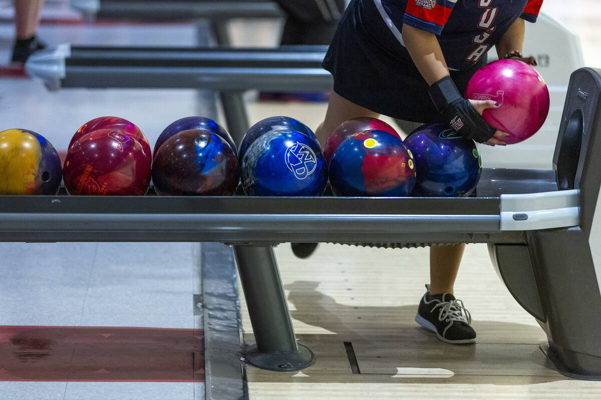 Coronado bowler Anastasia Dragulescu picks up her ball for another throw as they take on Clark ...