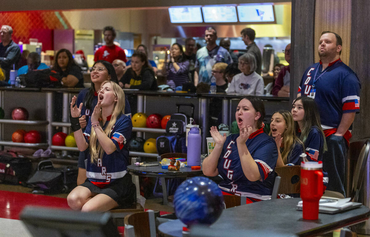 Coronado teammates cheer a great throw joined by head coach Nicholas Elefantis as they battle C ...