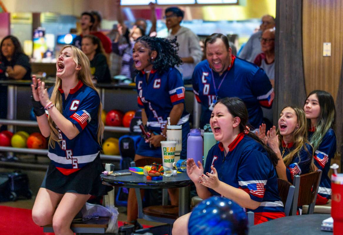Coronado teammates cheer a late strike joined by head coach Nicholas Elefantis as they battle C ...