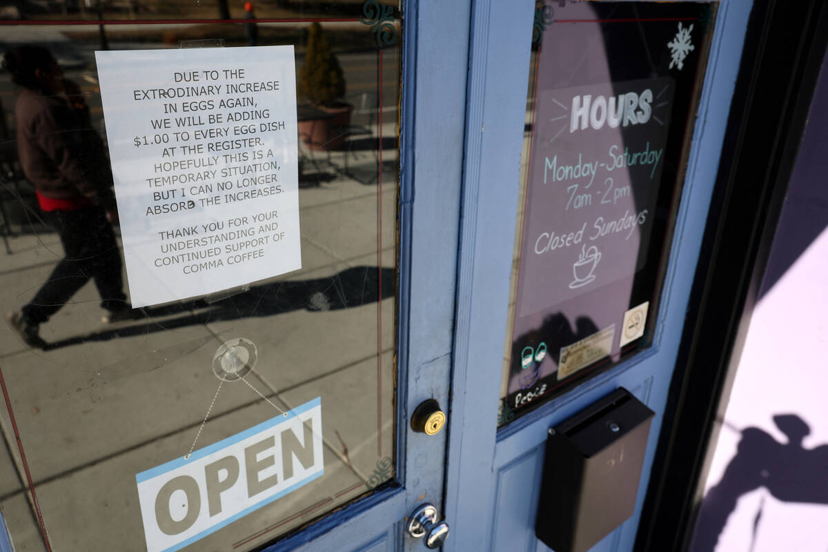 A sign announcing an additional $1 for egg dishes is seen at Comma Coffee across from the Legis ...