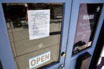 A sign announcing an additional $1 for egg dishes is seen at Comma Coffee across from the Legis ...