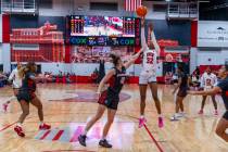 UNLV forward Meadow Roland (32) elevates for a basket over New Mexico Lobos forward Paris Lauro ...