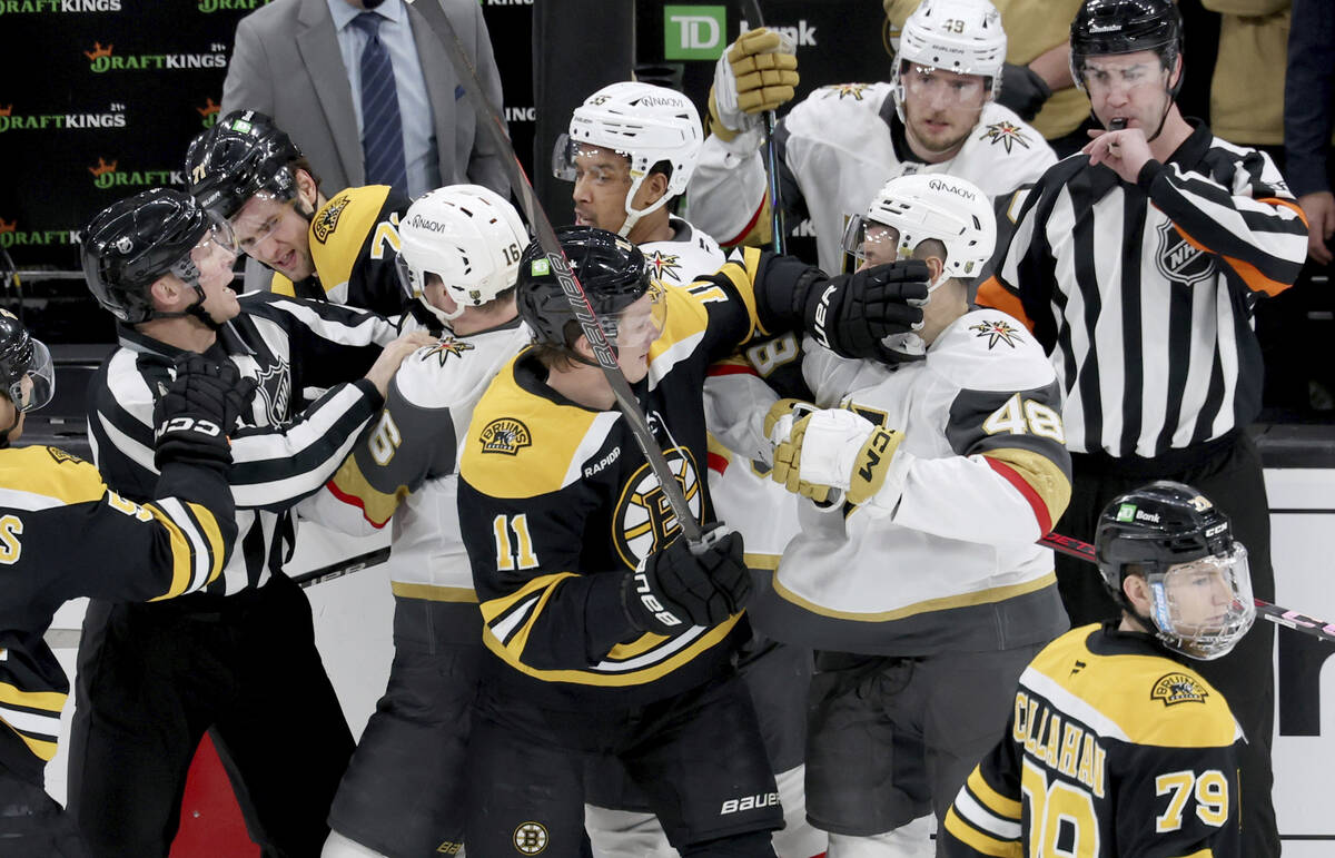 Boston Bruins and Vegas Golden Knights break out in a fight during the first period of an NHL h ...