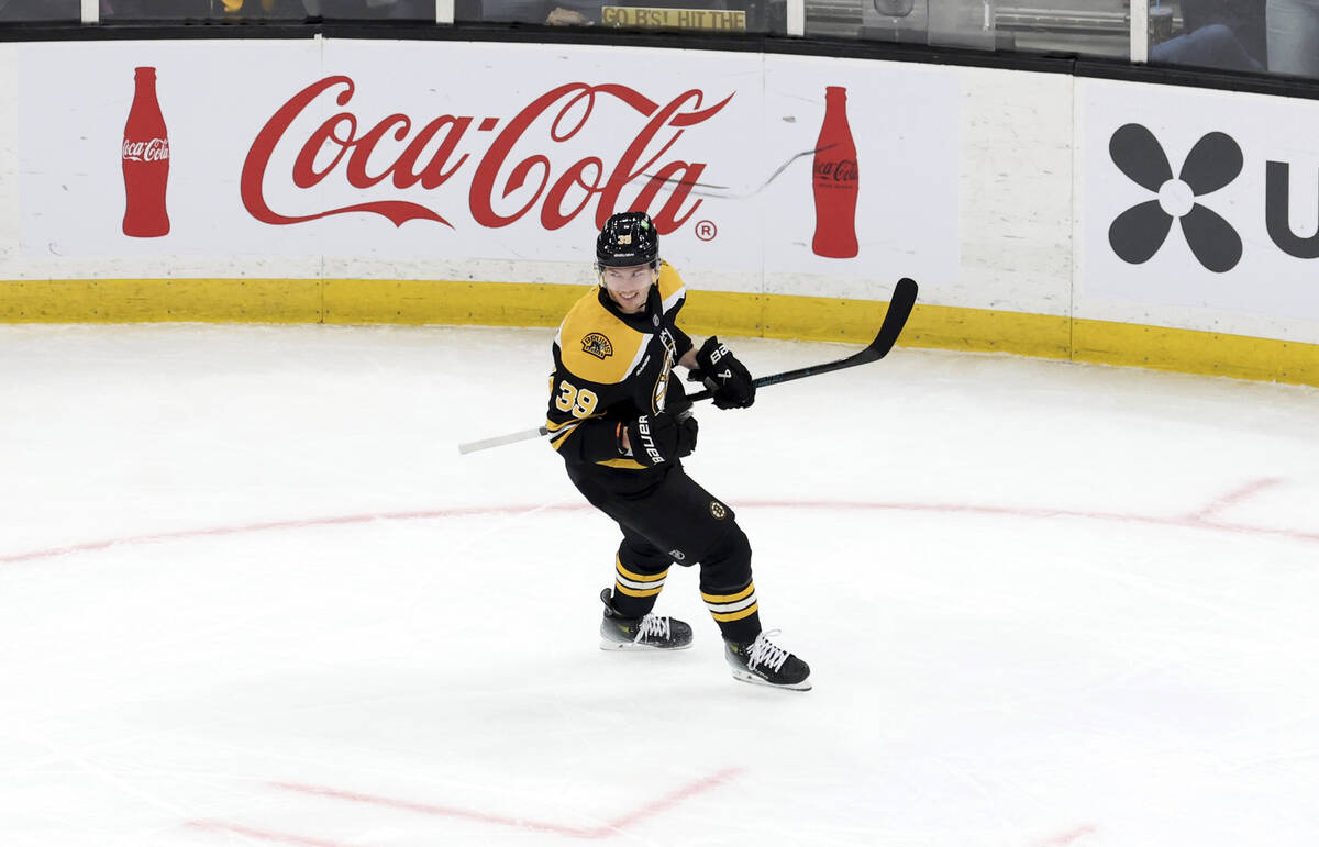 Boston Bruins center Morgan Geekie smiles after scoring during the second period of an NHL hock ...
