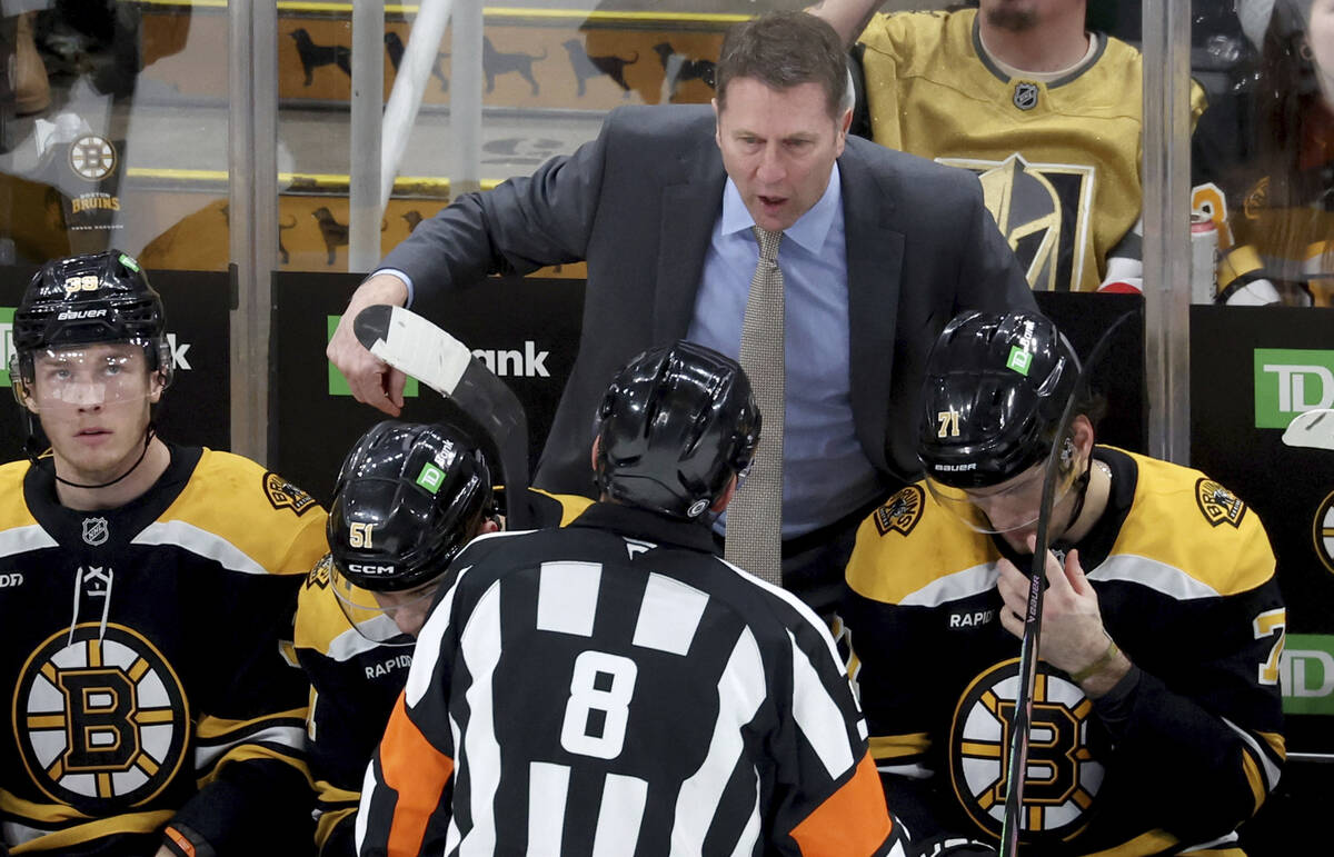 Boston Bruins head coach Joe Sacco argues a call with a game official during the third period o ...