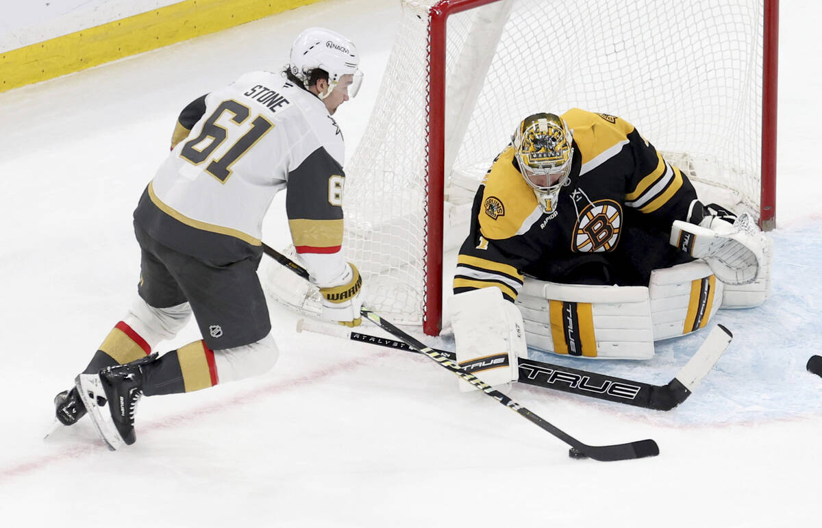 Boston Bruins goaltender Jeremy Swayman (1) blocks the puck on a goal attempt by Vegas Golden K ...