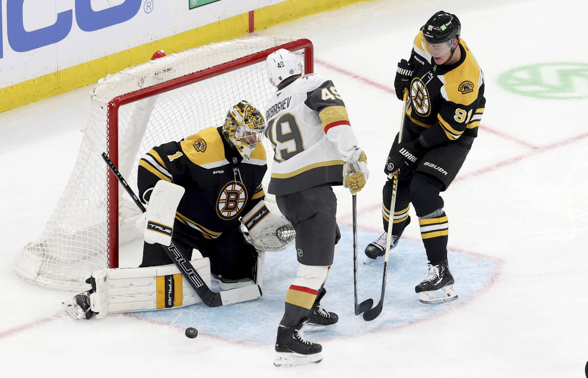 Boston Bruins goaltender Jeremy Swayman (1) and Boston Bruins defenseman Nikita Zadorov (91) de ...