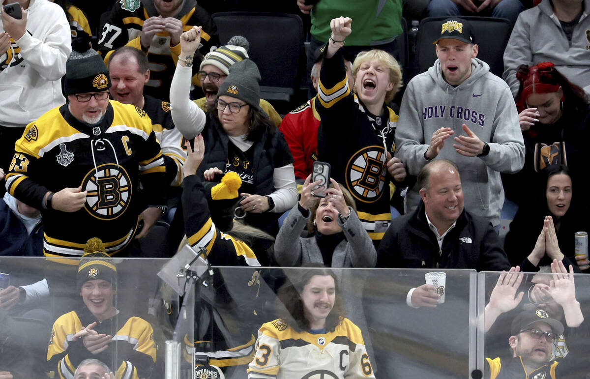 Boston Bruins fans cheer after a goal made by the Vegas Golden Knights was reversed during the ...