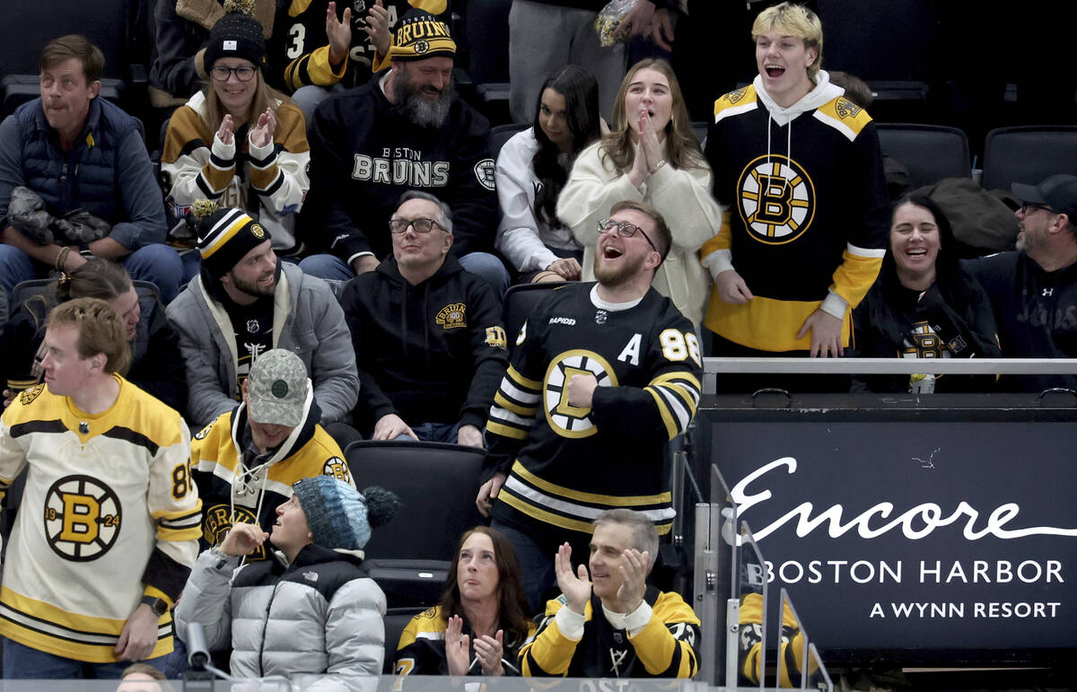 Boston Bruins fans cheer after a goal made by the Vegas Golden Knights was reversed during the ...