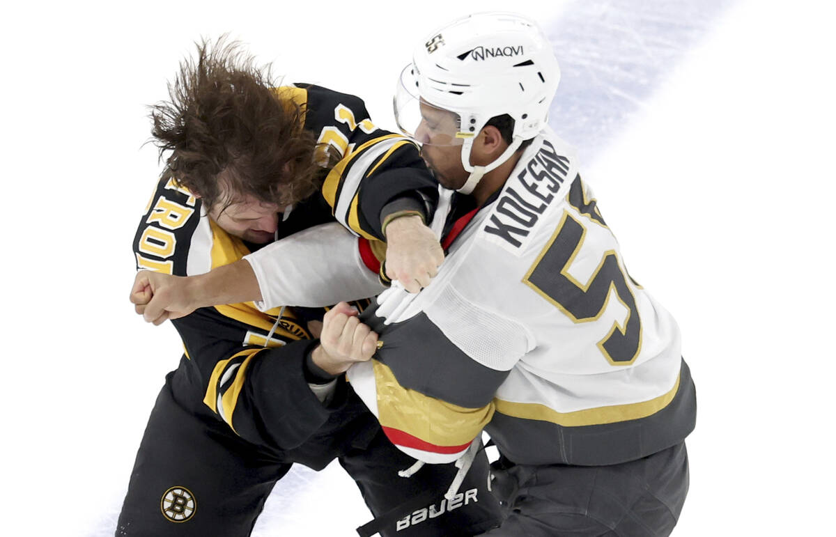 Boston Bruins right wing Oliver Wahlstrom, left, and Vegas Golden Knights right wing Keegan Kol ...