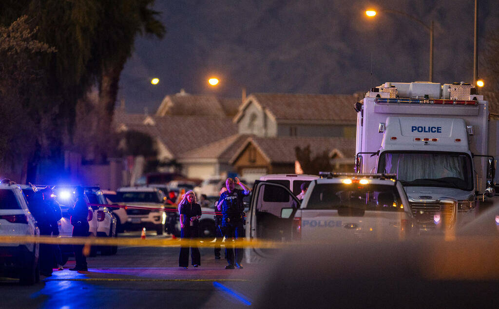Personnel depart the scene of a North Las Vegas Police officer-involved shooting along the 4700 ...