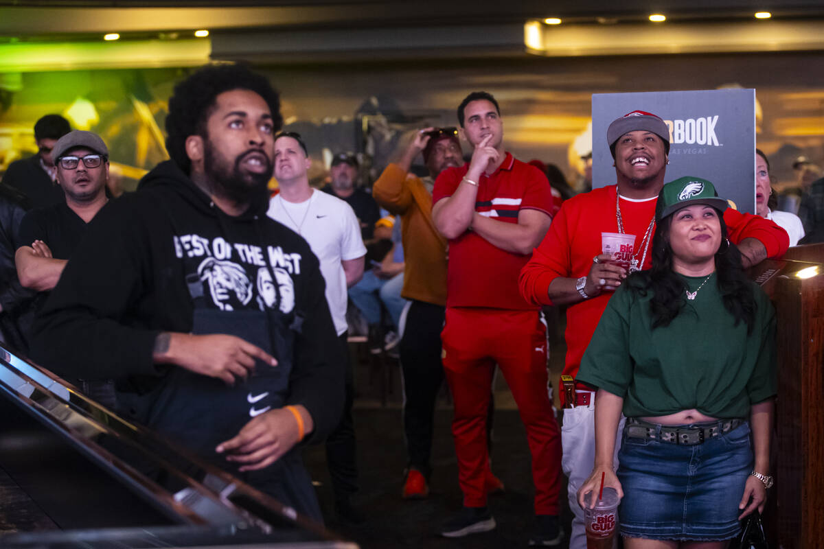Football fans watch as Super Bowl 59 between the Philadelphia Eagles and Kansas City Chiefs kic ...