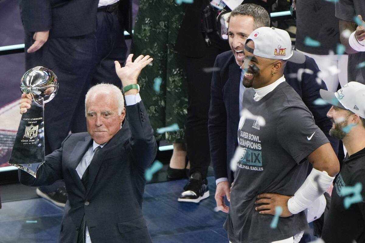 Philadelphia Eagles owner Jeffrey Lurie, left, celebrates with the Vince Lombardi Trophy as qua ...