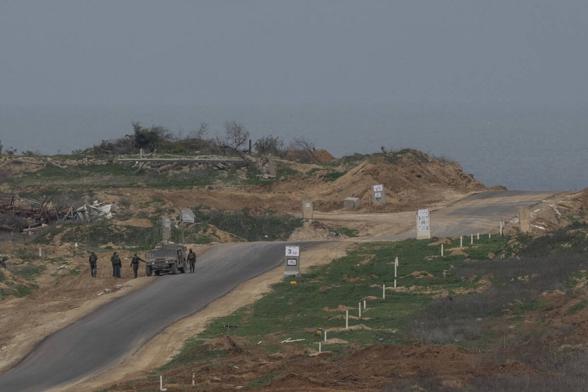 Israeli soldiers inside the northern Gaza Strip as seen from southern Israel, Sunday, Feb. 9, 2 ...