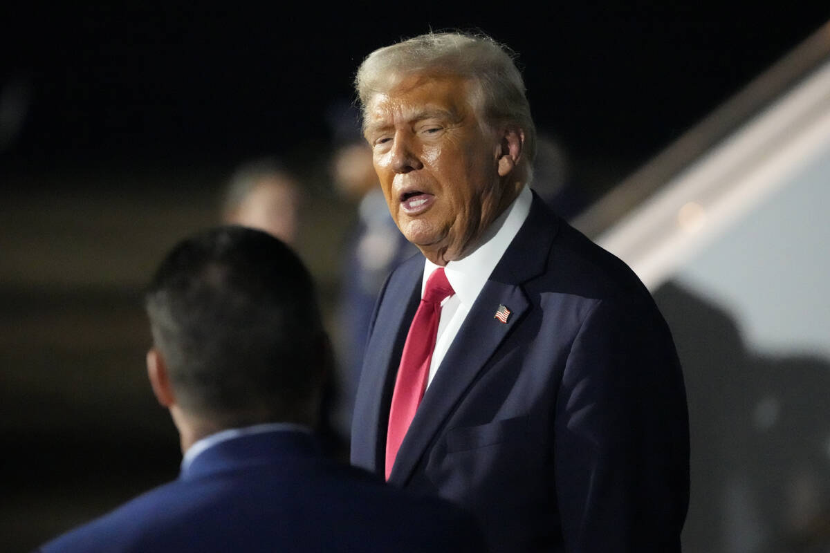 President Donald Trump is pictured before boarding Air Force One at the Naval Air Station Joint ...