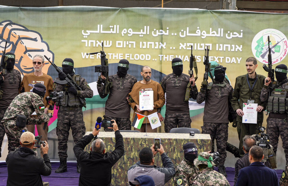 Israeli captives, from left to the right, Ohad Ben Ami, Eli Sharabi and Or Levy, who have been ...