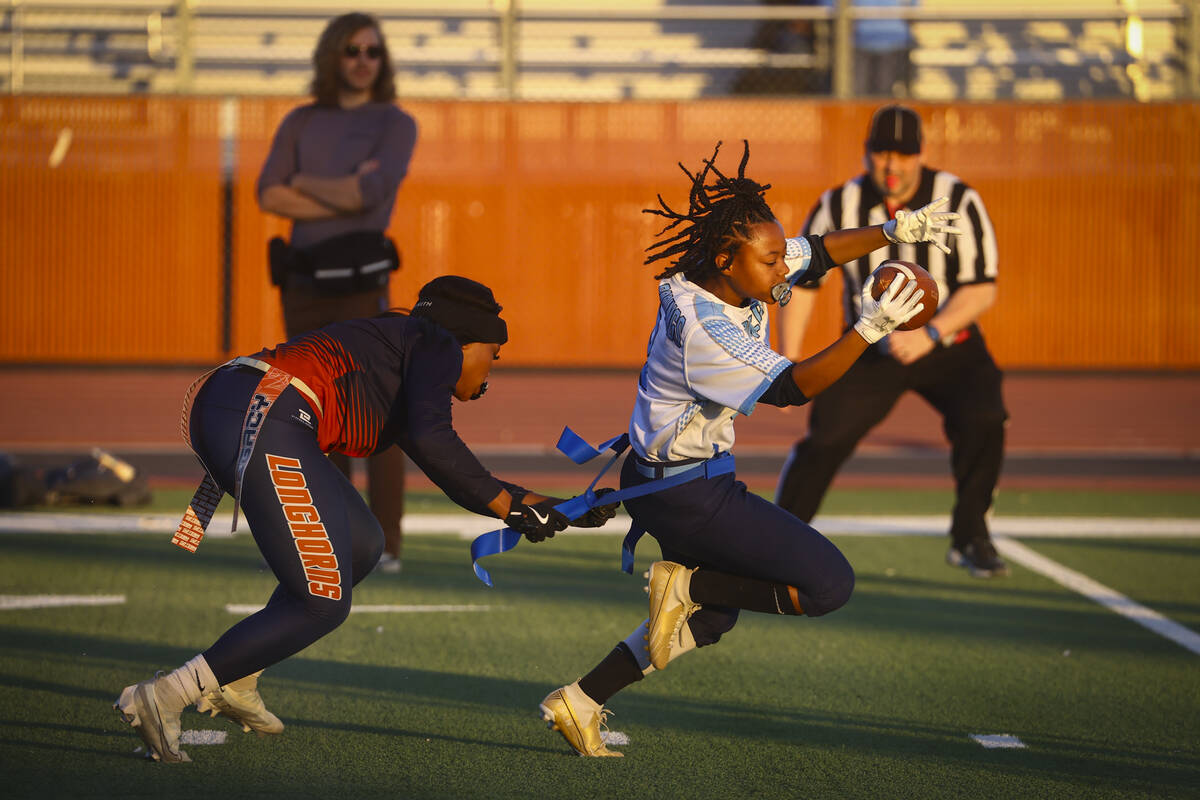 Canyon Springs' Amara Parish (8) gets tagged out by Legacy's Jamari Smith (8) during a 4A state ...