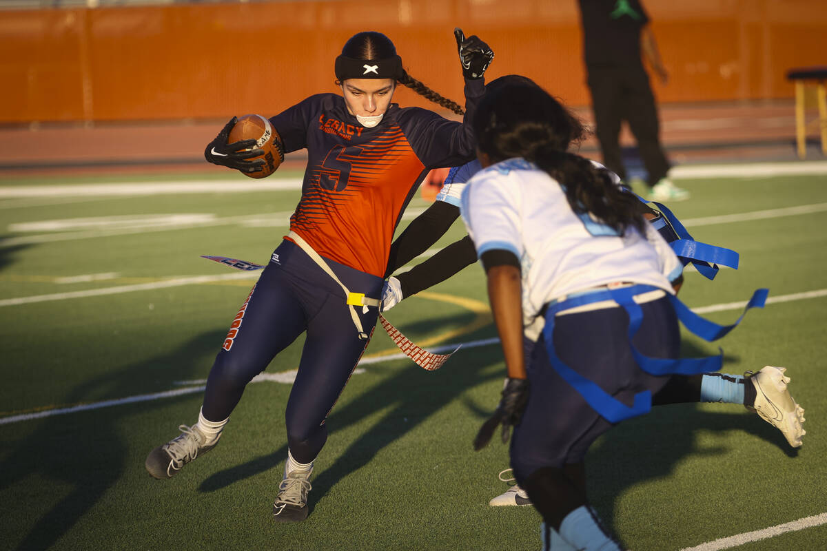 Legacy's Larissa Lotta (5) gets tagged out by Canyon Springs during a 4A state playoff flag foo ...