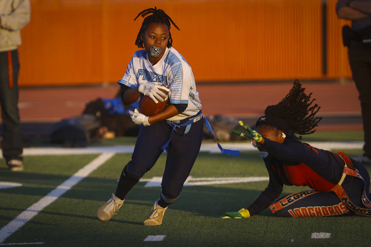 Canyon Springs' Amara Parish (8) gets past a Legacy defender during a 4A state playoff flag foo ...