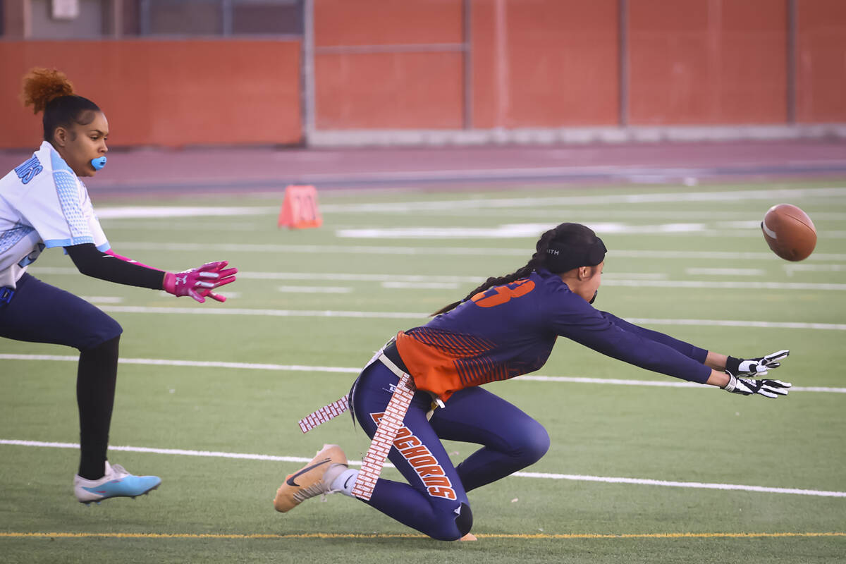Legacy's Savannah Kaina (23) comes up short on a reception under pressure from Canyon Springs d ...