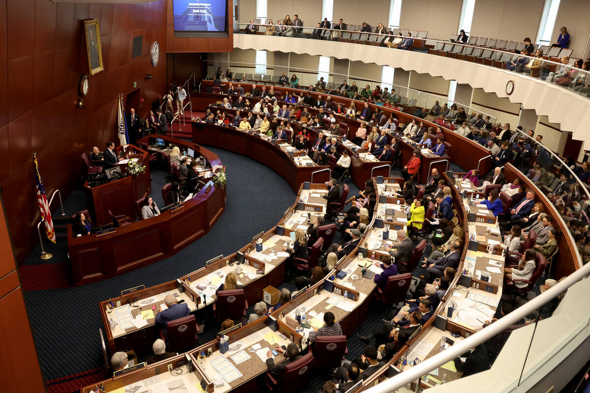 Assembly members meet during a floor session in the Legislative Building in Carson City on the ...