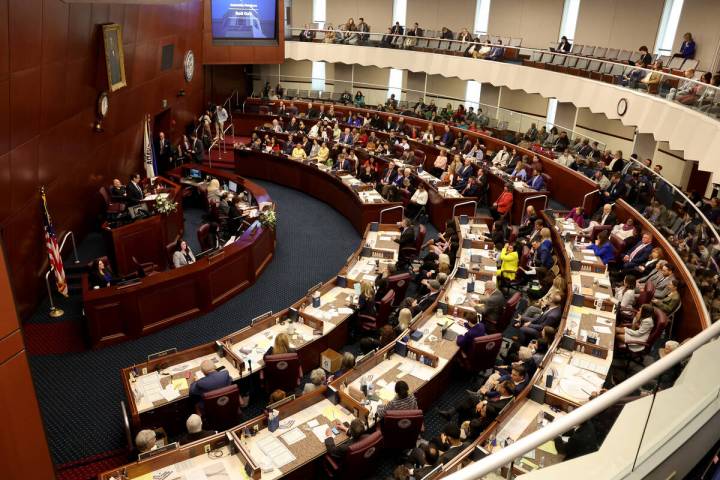 Assembly members meet during a floor session in the Legislative Building in Carson City on the ...