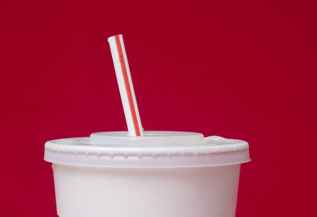 A large soft drink with a plastic straw from a McDonald's restaurant is shown in Surfside, Fla. ...