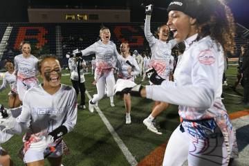 Liberty players celebrate after defeating Bishop Gorman in the 5A flag football state quarterfi ...